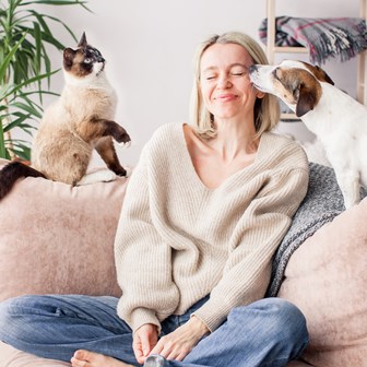 Woman with cat and dog 